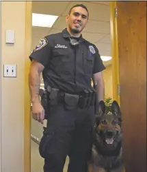  ??  ?? Middletown Police Officer Matthew Bloom with his K-9, Koda.