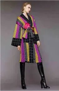  ??  ?? Belted wrap coat, designed by Duro Olowu, Autumn/ Winter 2015, England. © Duro Olowu