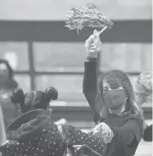  ?? BRAD HORRIGAN/HARTFORD COURANT ?? Students are greeted by staff as they enter Maria C. Colon Sanchez Elementary School on March 1. Starting Monday, more Hartford Public Schools students will be learning in person than virtually.