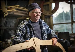  ??  ?? Plain sailing: John A Macaulay crafts sections of his own boat
