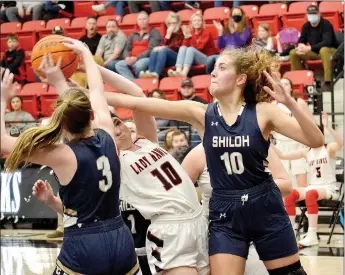  ?? TIMES photograph­s by Annette Beard ?? Senior Lady Blackhawk Ravin Cawthon fought to maintain control of the ball though heavily guarded by Lady Saints Friday, Jan. 22. For more photograph­s, go to https://tnebc.nwaonline.com/photos/.