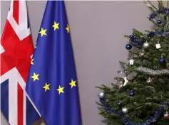  ??  ?? British and European Union flags are seen next to Christmas tree before arrival of British Prime Minister Theresa May to meet European Council President Donald Tusk, at the EU Council headquarte­rs in Brussels, Belgium December 11. – Reuters photo