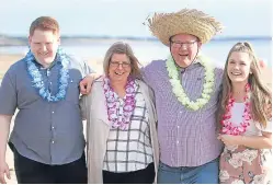  ??  ?? Life’s a beach – Mr and Mrs Forbes with son Aaron and daughter Chloe.