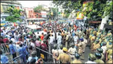  ?? —ANI ?? BJP activists gather near NRS Hospital during a protest against the alleged murder of party leader Manish Shukla in Titagarh.