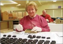  ?? SUBMITTED PHOTO ?? A volunteer makes chocolatec­overed candy at St. Mark’s Lutheran Church in Conshohock­en.