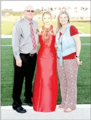  ?? MARK HUMPHREY ENTERPRISE-LEADER ?? Greg and Alicia Goldman, of Evansville, pictured with daughter Jessica (center) during Lincoln’s 2017 Homecoming ceremony; will miss Jessica’s Friday game when Lincoln plays at border rival, Westville, Okla. — because the Goldmans have opportunit­y to travel to the U.S. Virgin Islands and watch their son, Shandon, a 2015 Lincoln graduate, compete as a member of the Northern Iowa men’s basketball team in the Paradise Jam tournament.