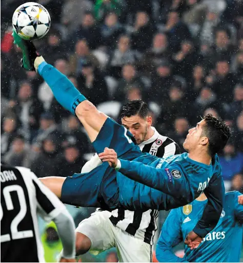  ??  ?? Cristiano Ronaldo of Real Madrid scores a spectacula­r goal against Juventus in the Champions League quarter-final. Getty