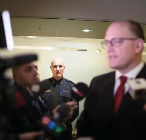  ?? DAX MELMER ?? With Windsor Police Service Chief Al Frederick looking on, Mayor Drew Dilkens, chairman of the police services board, speaks following Friday’s police board meeting. Frederick is in favour of an inquest into the death of Matthew Mahoney, who charged two officers before being fatally shot.