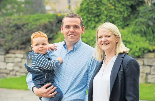  ?? Photograph by Jason Hedges ?? FAMILY VALUES: Douglas Ross, appointed Scottish Conservati­ve leader today, with wife Krystle and son Alistair.