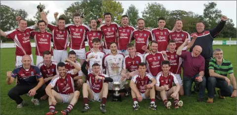  ??  ?? The St. Martin’s Junior footballer­s celebrate their second successive county title win in Oylegate on Saturday.