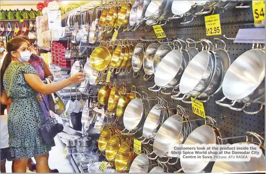  ?? .Picture: ATU RASEA ?? Customers look at the product inside the Shriji Spice World shop at the Damodar City Centre in Suva