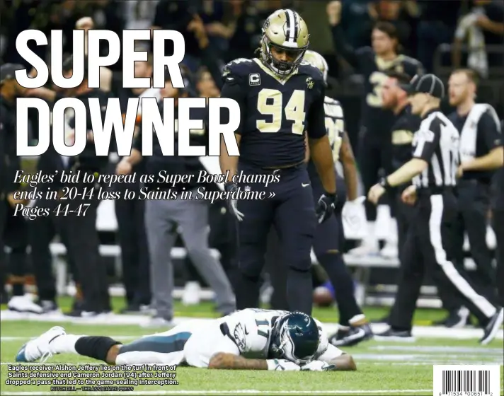  ?? BUTCH DILL — THE ASSOCIATED PRESS 8 2 ?? Eagles receiver Alshon Jeffery lies on the turf in front of Saints defensive end Cameron Jordan (94) after Jeffery dropped a pass that led to the game-sealing intercepti­on. Caption