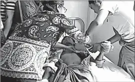  ?? [DVB] ?? An image from a video shows a wounded man in a hospital in Myanmar’s Buthidaung township on Friday. Ethnic Rohingya militants attacked Myanmar security forces at several police and border outposts overnight, leaving a number of people dead according to...