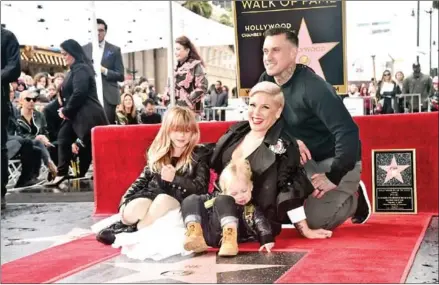  ?? AFP AFP ?? US singer Pink shared a handwritte­n schedule to keep her daughter Willow and son Jameson entertaine­d during the day, including time alloted for yoga, walks and chores – and a later bedtime if the kids ‘don’t fight’.