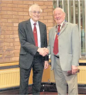  ??  ?? Brian Wood, the retiring Runcorn Probus chairman, handed over the chain of office to his successor Tom Bellfield Pic: David Haskell