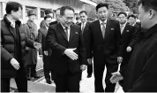  ??  ?? Head of North Korean delegation Ri Son Gwon (centre) is greeted by South Korean officials at Panmunjom in the Demilitari­sed Zone in Paju, South Korea on Tuesday