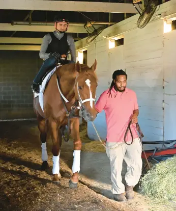  ?? TIMOTHY D. EASLEY/AP ?? Jerry Dixon Jr., groom for Kentucky Derby winner Rich Strike, is one of only a handful of Black horsemen who can be seen around the backside barns of tracks these days working as trainers, grooms and hot walkers.