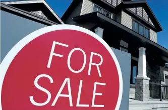  ?? POSTMEDIA NETWORK FILES ?? The Canadian Real Estate Associatio­n says Toronto and almost two-thirds of local markets across the country led a trend in sales pushing activity down 2.1 per cent nationally.