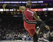  ?? MITCHELL LEFF / GETTY IMAGES ?? Dwyane Wade, watching his shot during a playoff game against Philadelph­ia, says he’ll think about his future after he returns from China.