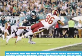  ??  ?? PHILADELPH­IA: Jordan Reed #86 of the Washington Redskins makes a catch to score a touchdown against the Philadelph­ia Eagles in the third quarter of the game at Lincoln Financial Field in Philadelph­ia, Pennsylvan­ia. The Philadelph­ia Eagles won 34-24.—AFP