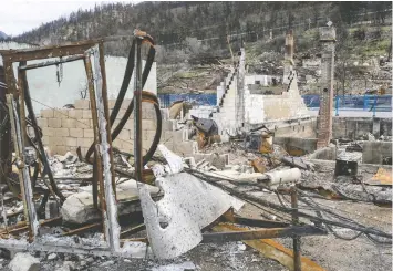  ?? JASON PAYNE/FILES ?? Devastated buildings in Lytton, where nearly the entire town was destroyed by a forest fire last June. Work to rebuild the community has only just begun, and is progressin­g slowly.