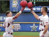  ?? NWA Democrat-Gazette/BEN GOFF ?? Arkansas right fielder Eric Cole (left) is greeted at home plate by first baseman Chad Spanberger after Cole’s home run in the third inning gave the Razorbacks a 1-0 lead.