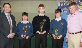  ??  ?? Adam Farrell, Darren O’Sullivan and Adam Segal receiving their honours at the Causeway Comprehens­ive School annual awards night last week, pictured with Principal Cathal Fitzgerald on left and teacher Tim Leahy, one of the organisers of the event.