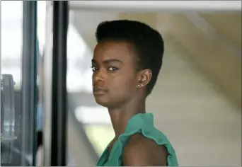  ?? RICHARD VOGEL — THE ASSOCIATED PRESS ?? Australian-South Sudanese model Adau Mornyang checks in through security for her court case at the Federal Courthouse in downtown Los Angeles on Monday.