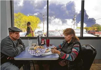  ?? Melissa Phillip / Staff file photo ?? Charlie Tamez and his wife, Dalia, finish their lunch at Ken’s Restaurant in March 2019 during the ITC chemical fire.
