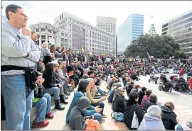  ?? RAY CHAVEZ — STAFF PHOTOGRAPH­ER ?? Hundreds of people listen to speakers during a rally in Oakland on Saturday.