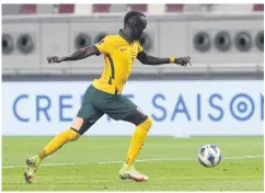  ?? AFP ?? Australia’s Awer Mabil scores against Oman in Doha.