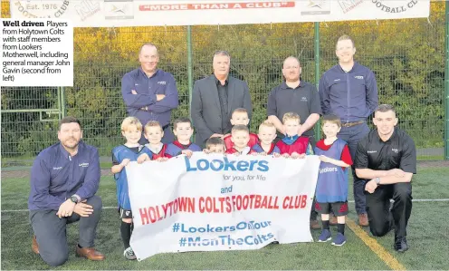  ??  ?? Well driven Players from Holytown Colts with staff members from Lookers Motherwell, including general manager John Gavin (second from left)