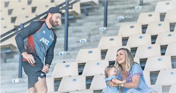  ?? Photo / Paul Taylor ?? TV presenter/wife Laura McGoldrick takes over the baby-sitting role, with 14-month-old Harley, from Black Caps hubby Martin Guptill at McLean Park, Napier, yesterday.