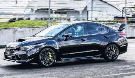  ??  ?? Fast and feral . . . Subaru’s 2018 WRX STi on track at the recent Hampton Downsbased launch.