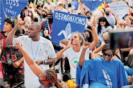  ?? ?? Climate activists protest outside the Sharm el-Sheikh Internatio­nal Convention Centre. (AFP)