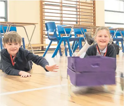  ?? Picture: Paul Reid. ?? A test drive for Cortachy Primary pupils Patrick Highland and Grace Simmonds.