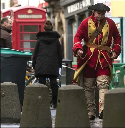  ??  ?? Time traveller: An extra in Edinburgh, where filming for Outlander was under way yesterday