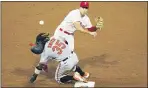  ?? MATT SLOCUM — THE ASSOCIATED PRESS ?? Phillies second baseman Scott Kingery, top, throws to first after forcing out Baltimore’s Dwight Smith Jr. at second on Tuesday.