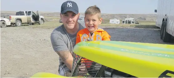  ?? CAROL DOUGLAS ?? Wheeler Boys’ son Jaxon is a car-crazy kid who takes after his dad, granddad and great granddad. The five-year-old will be racing on a dirt track this season.