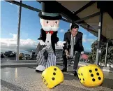  ?? PHOTO: CAMERON BURNELL/FAIRFAX NZ ?? Mr Monopoly and Wellington mayor Justin Lester celebrate the announceme­nt of a Wellington edition of Monopoly.