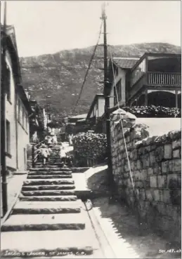  ??  ?? UP AND UP: Other places have roads, St James has flights of stairs. This is Jacob’s Ladder, which runs up the mountain all the way from Main Road to Boyes Drive. It is not clear when the ‘then’ picture was taken, but it was published as a postcard. The...