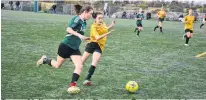  ?? JASON SIMMONDS • THE GUARDIAN ?? Carmen Moffatt, right, of the Kensington Torchettes, and the Hernewood Huskies’ Charli Augustine race for the ball during the P.E.I. School Athletic Associatio­n Intermedia­te A Girls Soccer League championsh­ip game. Hernewood won the game, played at the Terry Fox Sports Complex in Cornwall on Saturday morning, by a 4-1 score.