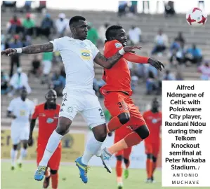  ?? / ANTONIO M U C H AV E ?? Alfred Ndengane of Celtic with Polokwane City player, Rendani Ndou during their Telkom Knockout semifnal at Peter Mokaba Stadium.