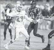  ?? Rob Brown Associated Play ?? CORN ELDER throws one of Miami’s eight laterals before catching one and running 75 yards for the winning touchdown on last play against Duke.