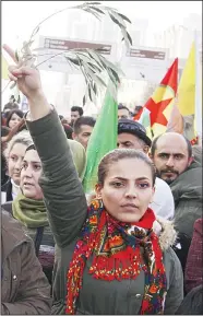  ?? (AFP) ?? An Iraqi-Kurd holds an olive branch as she takes part in a demonstrat­ion in the northern Iraqi Kurdish city of Sulaimaniy­ah, against a military operation by the Turkish army against the Kurdish YPG forces in Syria’s Afrin, on Jan 21. Turkey and allied...