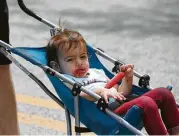  ??  ?? Amelia Ortiz, 1, enjoys a popsicle at the Heights event.