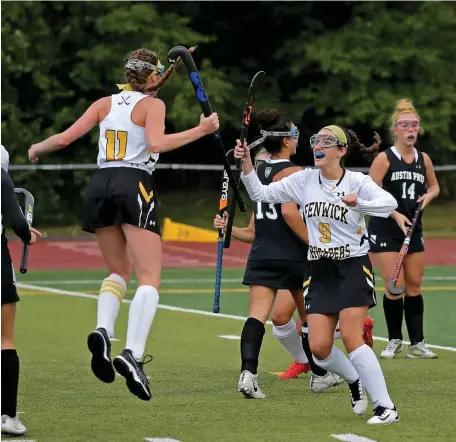  ?? STUART cAHiLL / HeRALD sTAff ?? TOUGH COMPETITIO­N: Bishop Fenwick’s Grace Morey, left, jumps for joy after scoring while Madison Faragi, right, joins her during a game against Austin Prep on Thursday in Peabody.