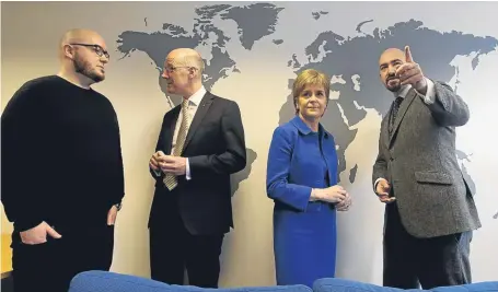  ?? Picture: PA. ?? First Minister Nicola Sturgeon and Deputy First Minister John Swinney, second left, with tech firm Codebase co-founders Stephen, left, and brother Jamie Coleman during a visit to the Edinburgh firm yesterday.