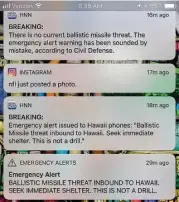  ?? Eugene Tanner / AFP / Getty Images ?? A screenshot taken by the photograph­er off his cellphone shows messages about the alerts in Hawaii. “THIS IS NOT A DRILL,” set off panic among some residents and tourists.