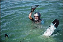  ??  ?? Austin American-Statesman writer Pam LeBlanc floats in the waters of the Aquaplex ski lake in Martindale before her first attempt at water ski jumping.